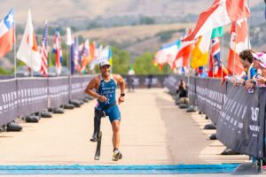 Silver Paralympics medalist Mohamed Lahna crossing Wildflower Experience Finish Line