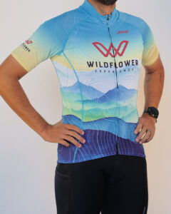Male model wearing the 2026 Wildflower Experience cycling jersey by Zoot