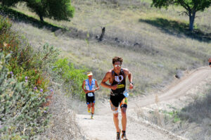 Triathlon racer Jesse Thomas running on the Wildflower Experience trail. 