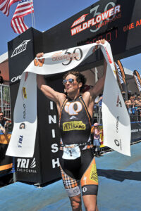 Triathlon racer Jesse Thomas finishing the Wildflower Experience race.