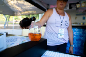 Pouring Wildflower Wine during the festival experience